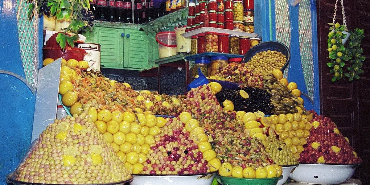 Traditional Moroccan food spread in Meknes with olives, tagine, and fresh bread
