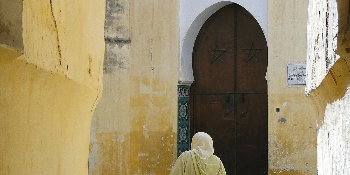 Bab Mansour gate in Meknes Morocco with intricate zellige tilework and grand archway